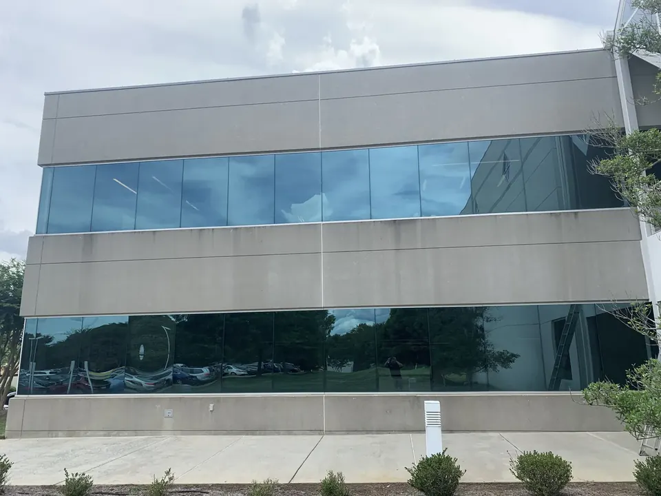 Reflective windows across a modern commercial building