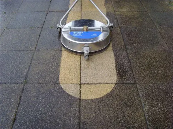Surface cleaner cutting a clean path through a dark hard surface